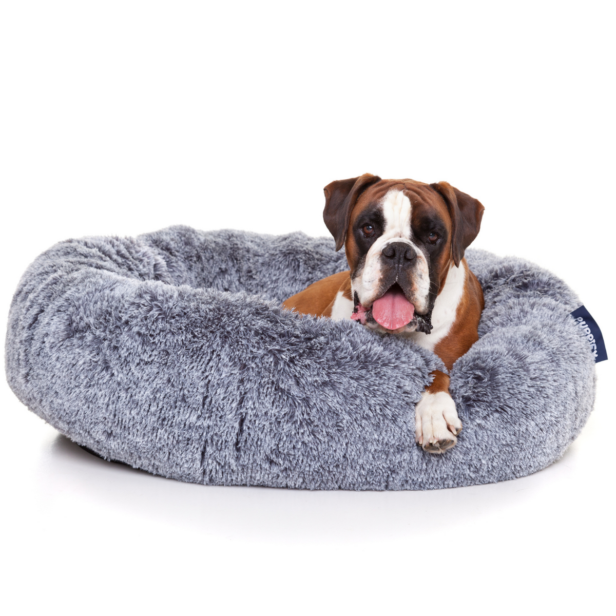 Rond hondenbed van Puppify met innovatief ontwerp voor de ideale slaaphouding.